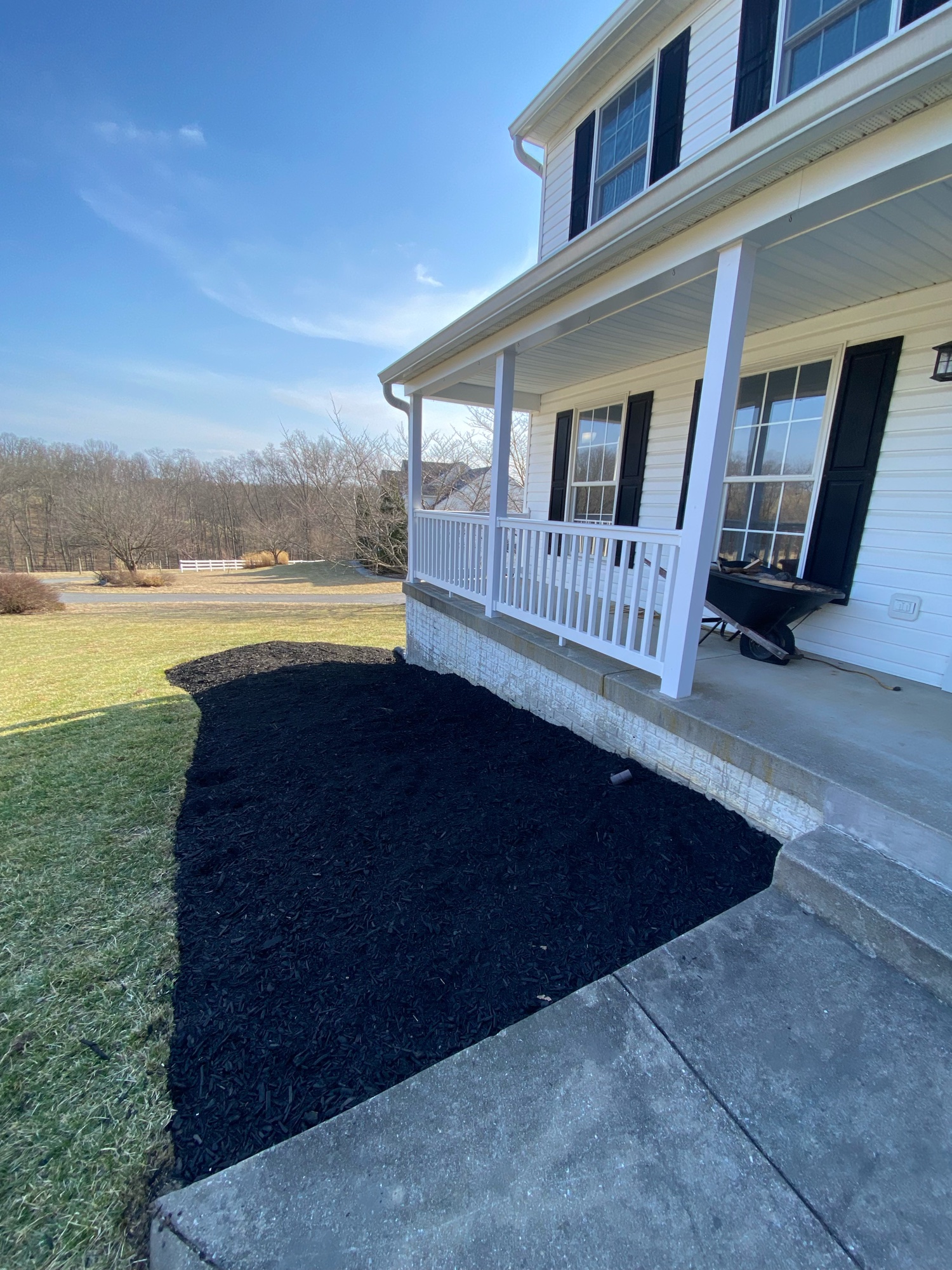 Farmhouse front — driveway + mulch bed install
