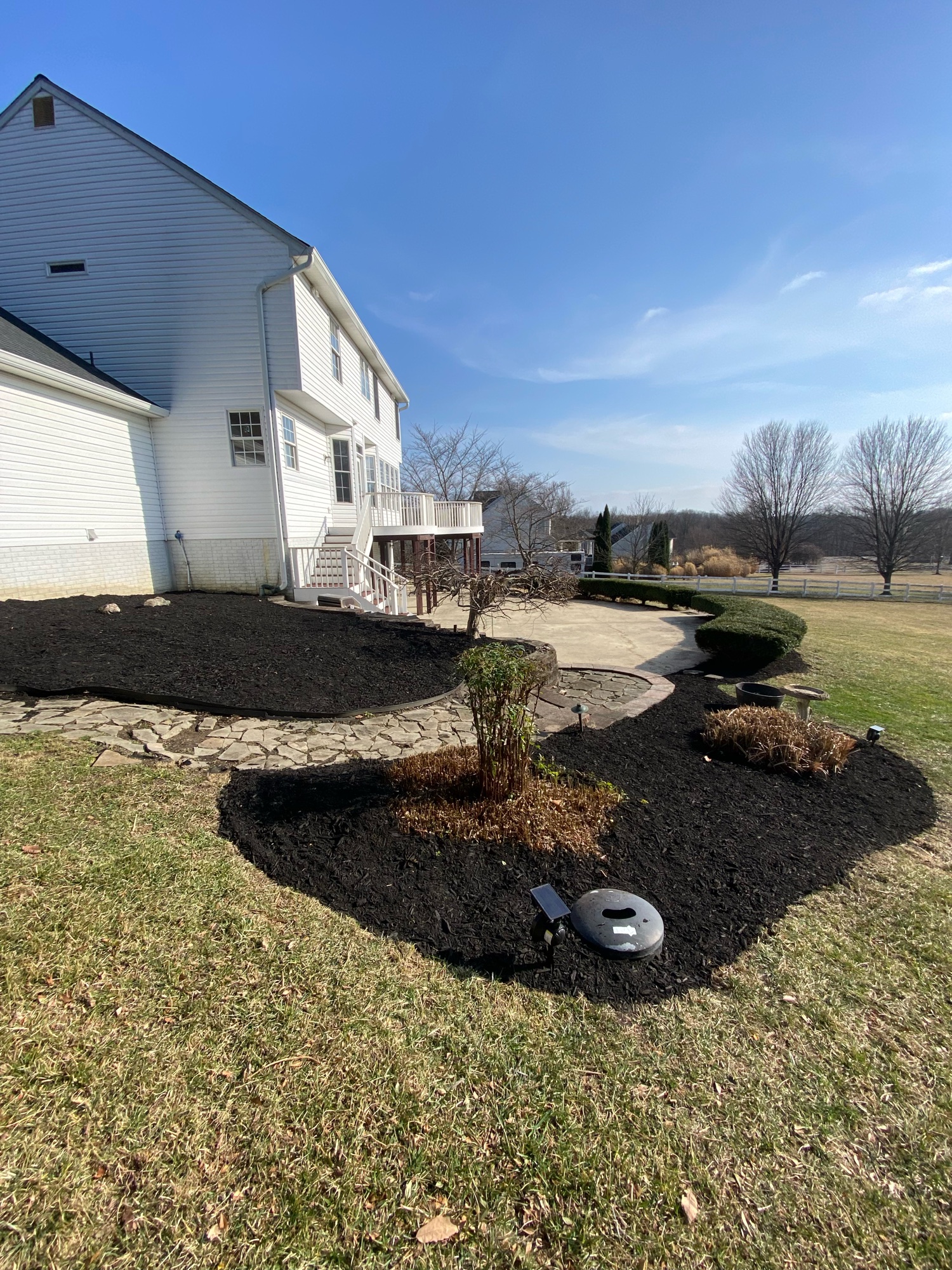 Fresh black mulch beds with solar accent lights